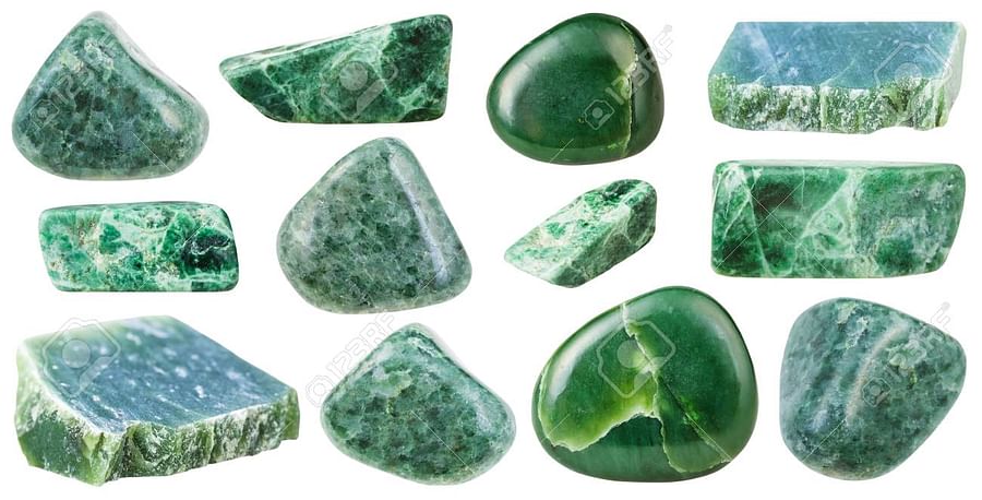Collection of various green crystals including Emerald, Jade, Green Aventurine, and Malachite